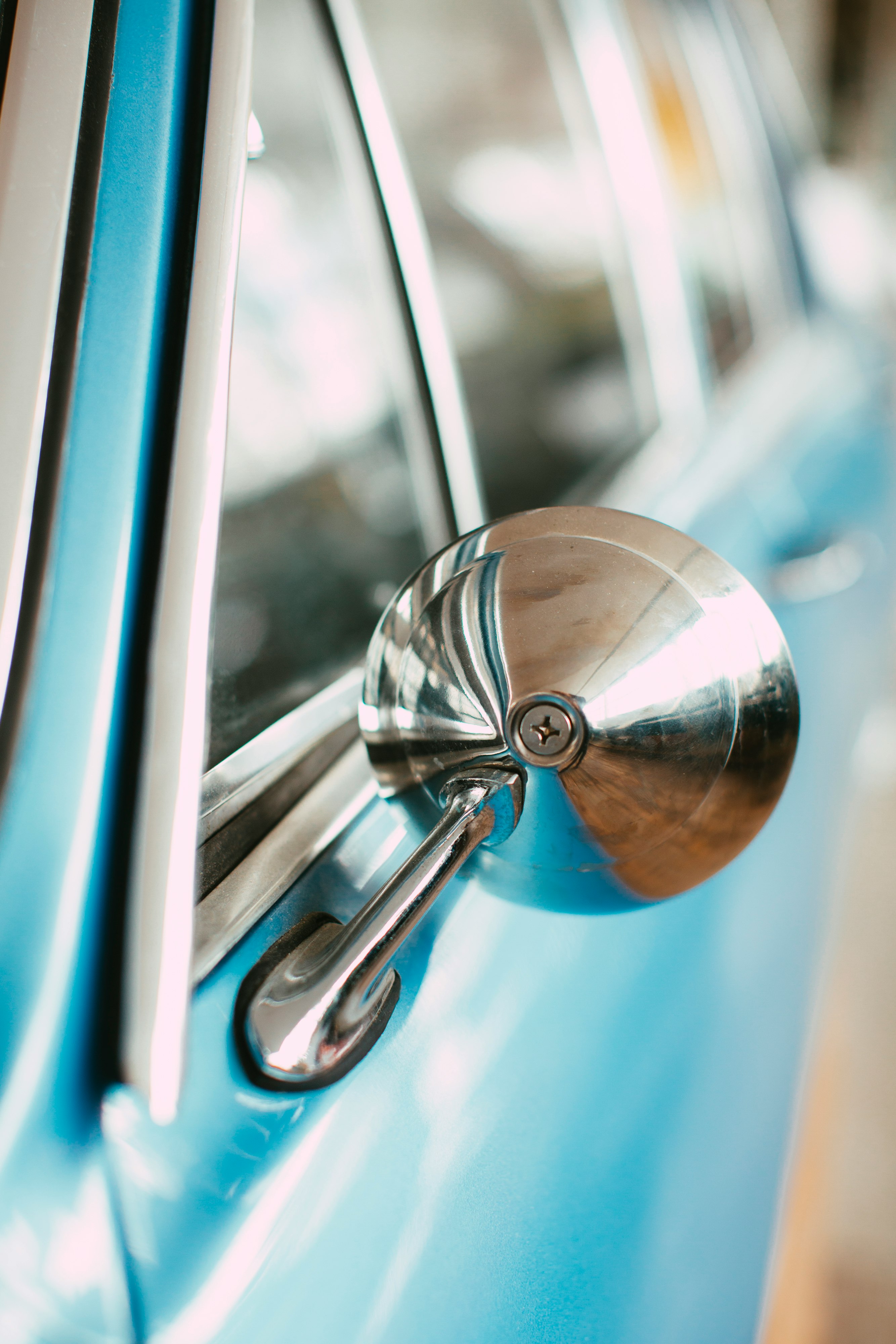 silver door knob in blue car